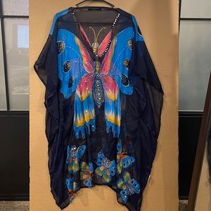 Multi colored, butterfly shaped graphics shirt/and or dress.